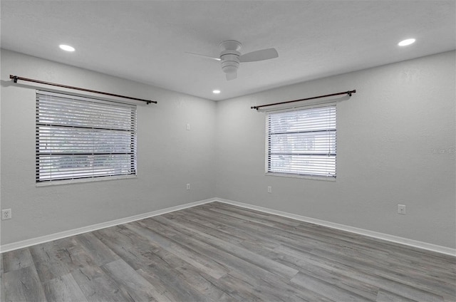 unfurnished room with light hardwood / wood-style floors and ceiling fan