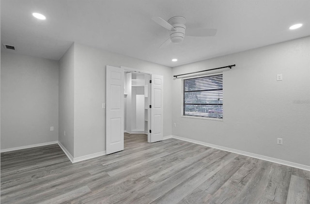 unfurnished bedroom featuring ceiling fan and light hardwood / wood-style flooring