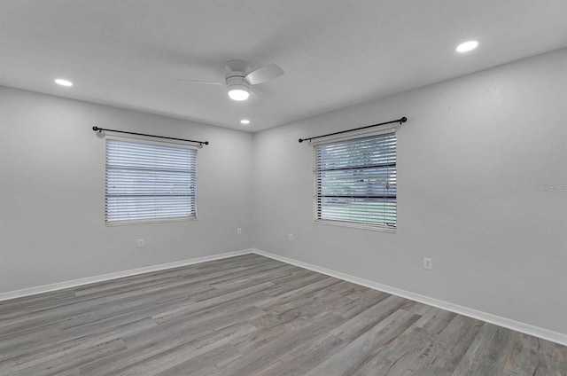 empty room featuring light wood-type flooring and ceiling fan