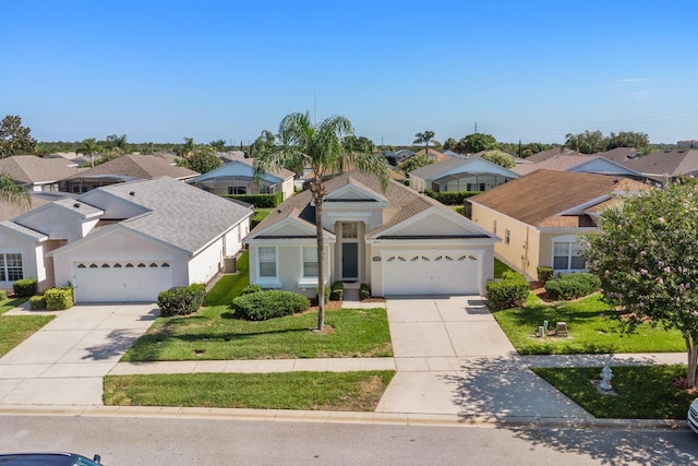 view of front of property featuring a front lawn and a garage