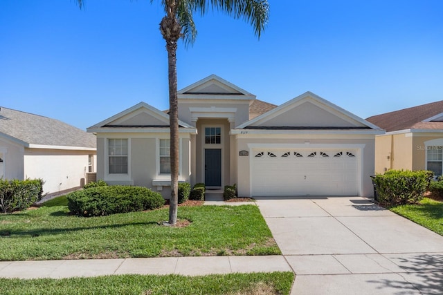 view of front of home with a garage and a front yard