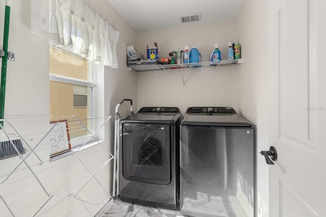 laundry room with independent washer and dryer