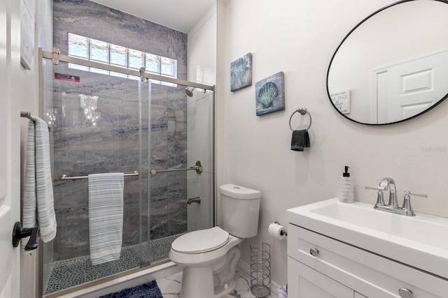 bathroom with vanity, toilet, and walk in shower