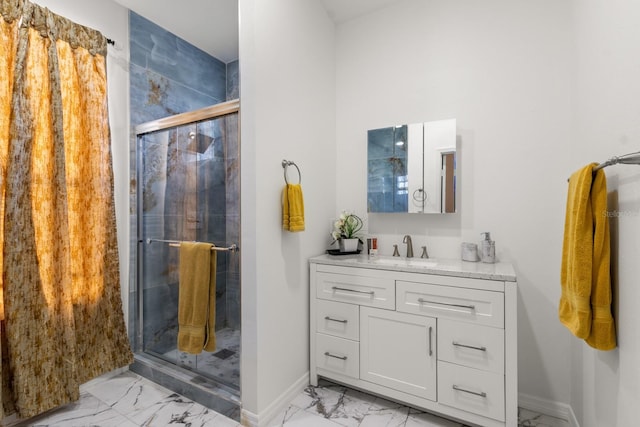 bathroom featuring vanity and a shower with shower door