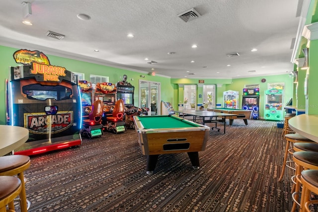 playroom featuring dark carpet, a textured ceiling, billiards, and french doors