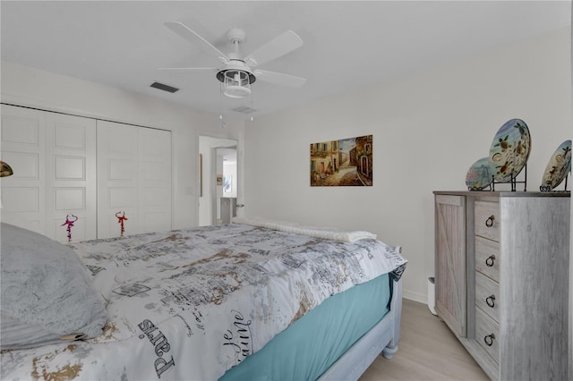 bedroom with ceiling fan and a closet