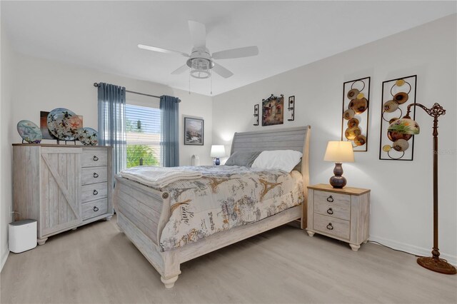 bedroom featuring ceiling fan and light hardwood / wood-style flooring