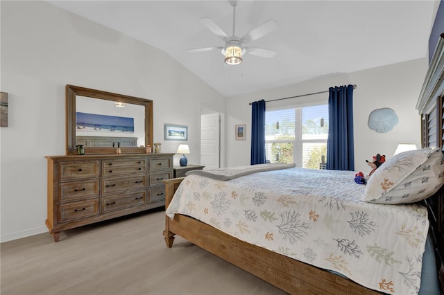 bedroom featuring light hardwood / wood-style floors, ceiling fan, and lofted ceiling