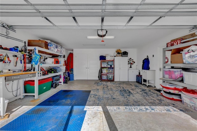 garage featuring a workshop area and a garage door opener