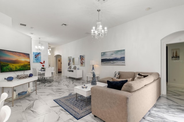 living room with an inviting chandelier