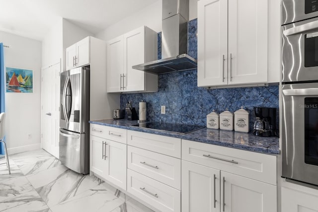 kitchen featuring backsplash, white cabinets, stainless steel refrigerator with ice dispenser, wall chimney exhaust hood, and black electric cooktop