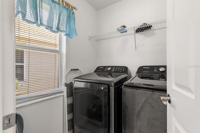 laundry room with independent washer and dryer