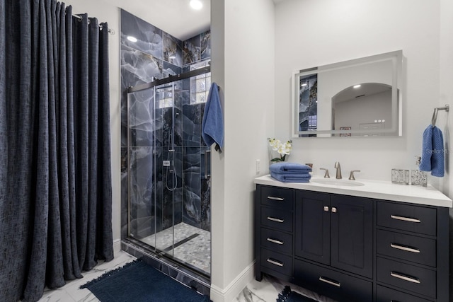 bathroom featuring vanity and an enclosed shower