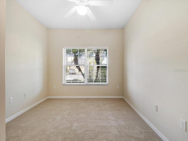 carpeted empty room with ceiling fan