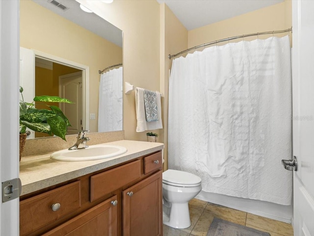 bathroom featuring a shower with curtain, tile patterned flooring, vanity, and toilet