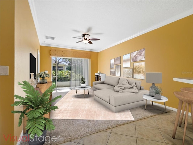 tiled living room featuring crown molding and ceiling fan