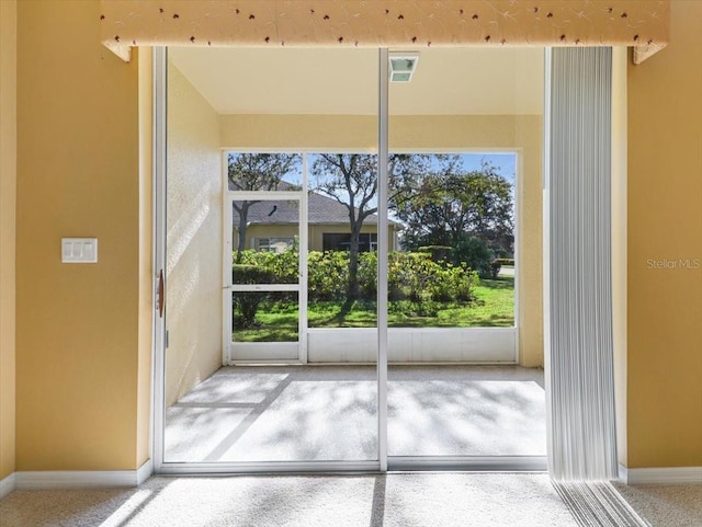 doorway to outside featuring a wealth of natural light