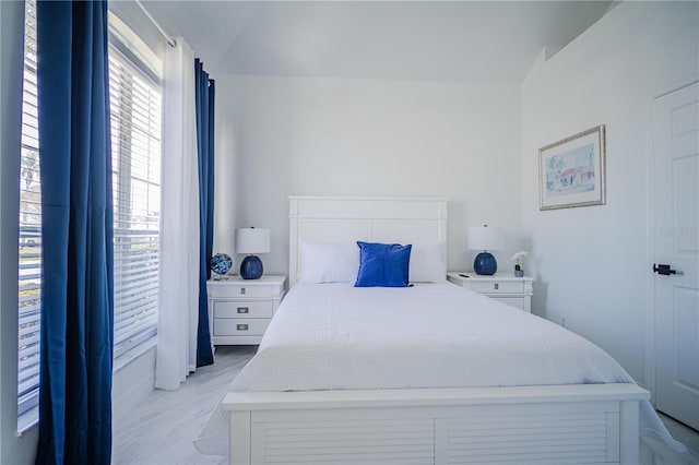 bedroom with lofted ceiling