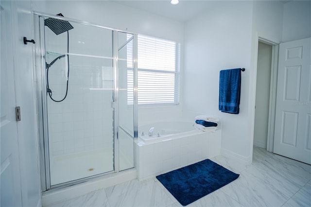 bathroom with plenty of natural light and independent shower and bath