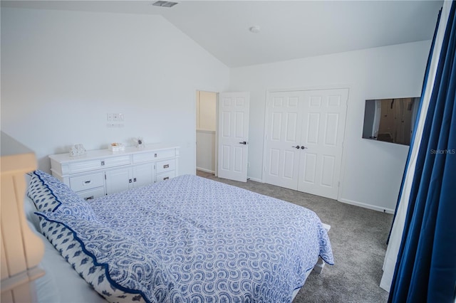 bedroom with a closet, carpet floors, and lofted ceiling