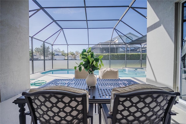 view of patio with glass enclosure and a pool with hot tub