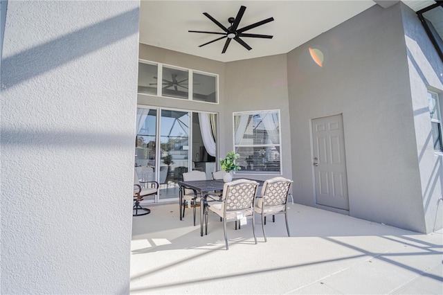 exterior space featuring ceiling fan