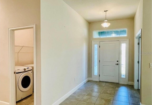 entryway featuring washer / clothes dryer and a healthy amount of sunlight