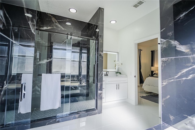 bathroom with vanity, tile patterned floors, and walk in shower