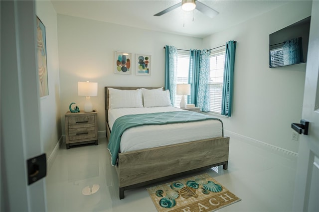 bedroom with light tile patterned floors and ceiling fan