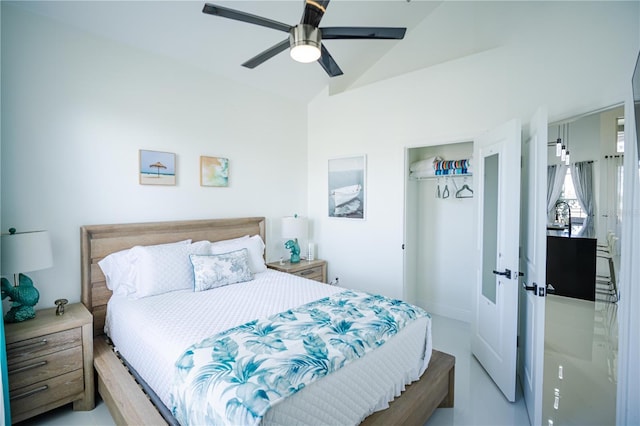 bedroom with a closet, lofted ceiling, and ceiling fan