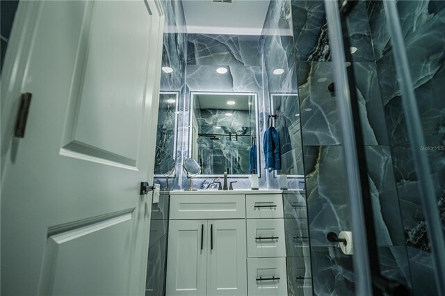 bathroom featuring vanity and walk in shower