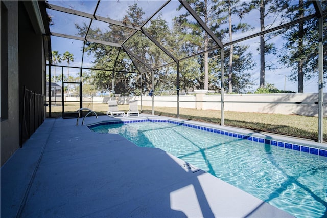 view of pool with a lanai and a patio area