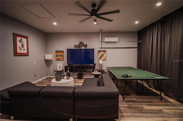 living room with hardwood / wood-style flooring and ceiling fan