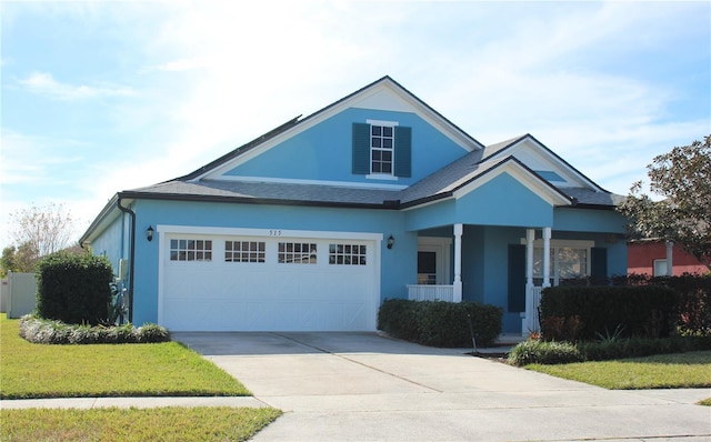 view of front of home with a garage and a front yard