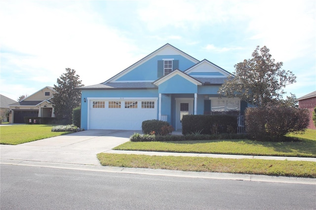 view of front of home with a garage and a front lawn