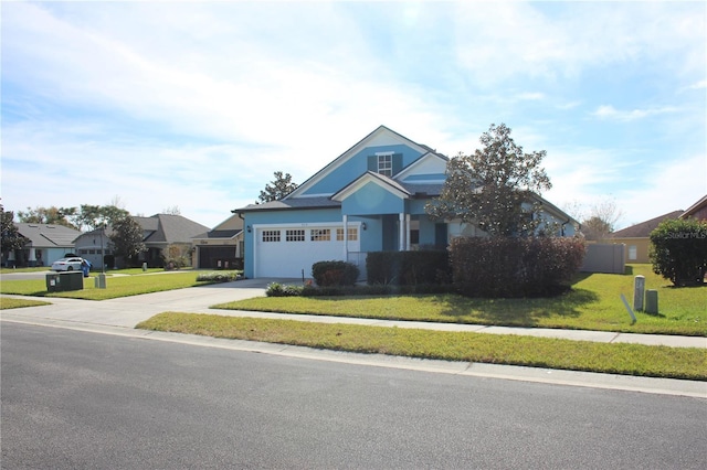 view of front of property featuring a garage and a front yard