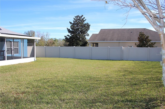 view of yard featuring a sunroom