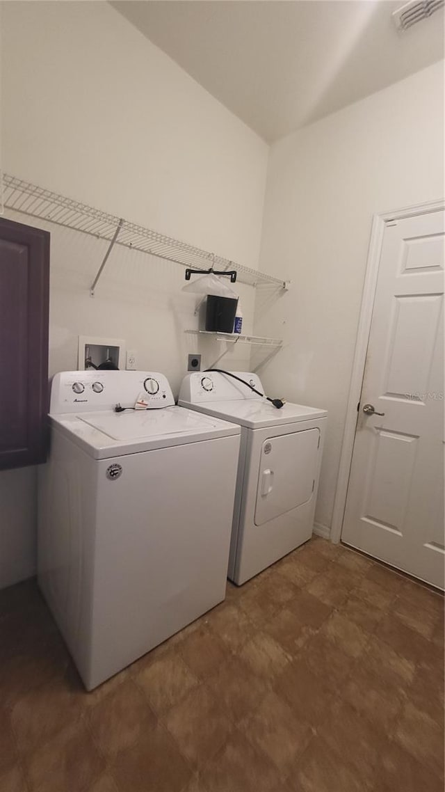 laundry room with washer and clothes dryer