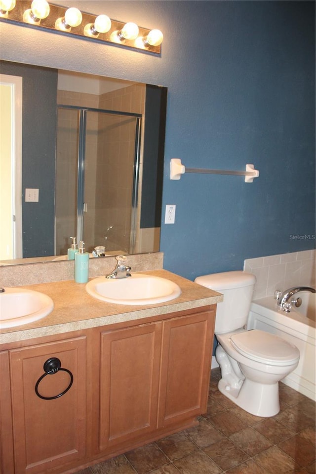 full bathroom with vanity, plus walk in shower, and toilet