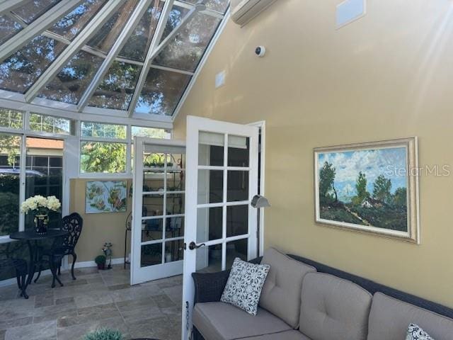 sunroom with french doors and vaulted ceiling