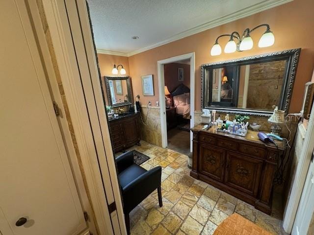 bathroom with vanity and crown molding