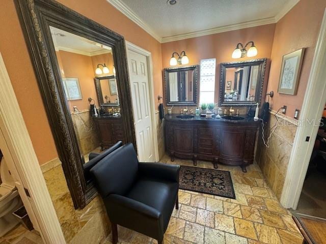 bathroom featuring a textured ceiling and crown molding