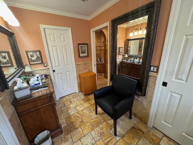 sitting room featuring crown molding