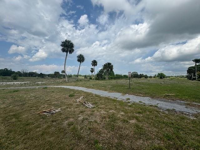 view of yard with a rural view