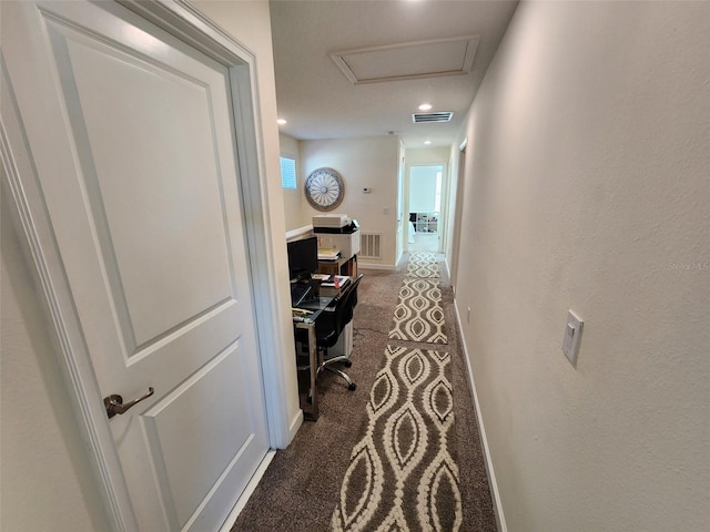 hallway with dark carpet