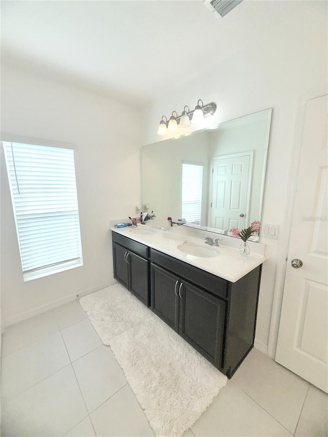 bathroom with tile patterned flooring and vanity