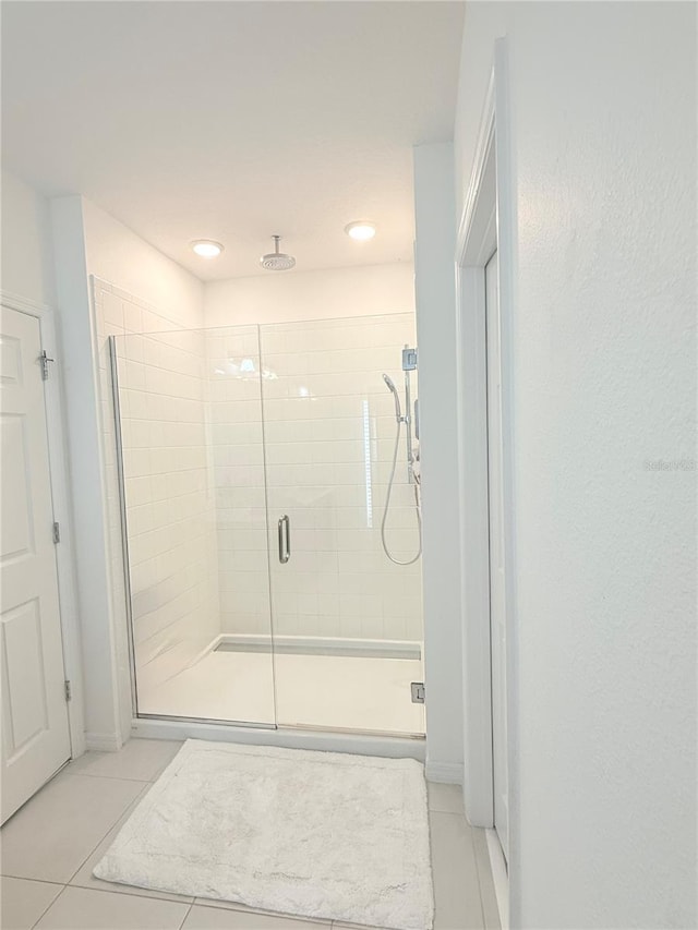 bathroom featuring tile patterned floors and walk in shower