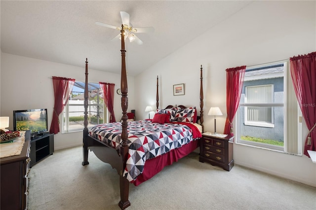 carpeted bedroom with ceiling fan and lofted ceiling