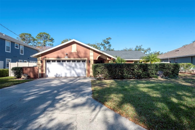 view of front facade featuring a garage and a front lawn