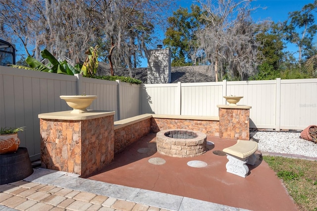 view of patio / terrace featuring an outdoor fire pit